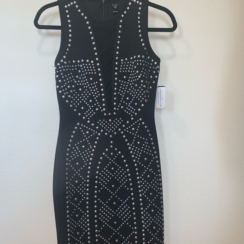Tight black studded dress